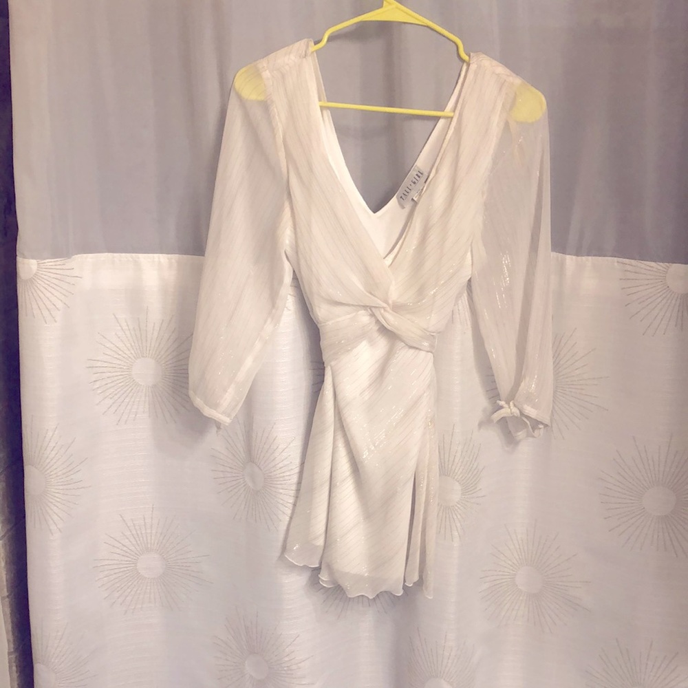 White and shimmery silver blouse with low v-neck. - Picture 1 of 3